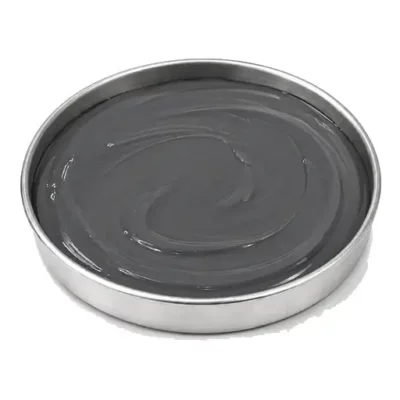 Representative aerospace sealant and potting compound in a shallow stainless steel sample dish