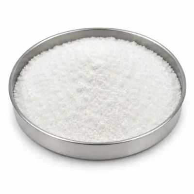 Lithium carbonate and hydroxide salt powder in a stainless steel sample dish