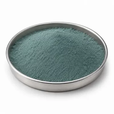 Ceramic glaze, enamel, and pigment powder in a shallow stainless steel sample dish