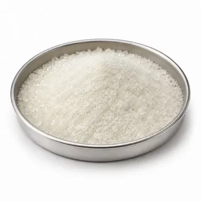Glass frits and powdered glass in a shallow stainless steel sample dish
