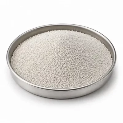Spray-dried ceramic granules in a shallow stainless steel sample dish