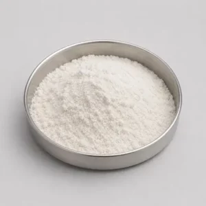 Fine dairy or protein powder in a stainless steel sample dish