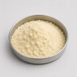 Pale yellow fat-rich food powder in a stainless steel sample dish