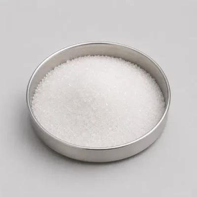 Crystalline sugar and salt ingredients in a stainless steel sample dish