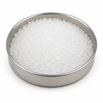 Translucent specialty elastomer granules in a stainless steel sample dish