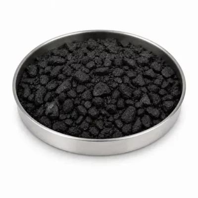 Coal and coke carbonaceous mineral in a stainless steel sample dish