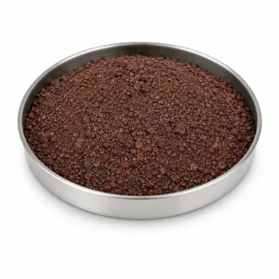 Iron ore fines and mineral concentrate in a stainless steel sample dish