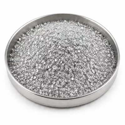 Metallic effect pigment flakes in a stainless steel sample dish