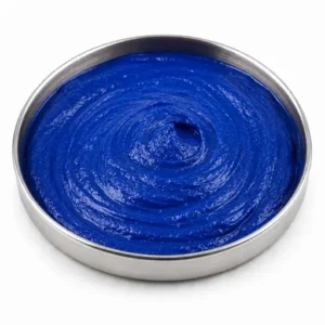Blue waterborne pigment slurry in a shallow stainless steel sample dish