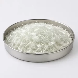 Chopped white reinforcement fibers in a stainless steel sample dish