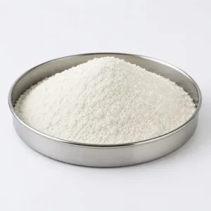 Fine white polymer powder in a stainless steel sample dish