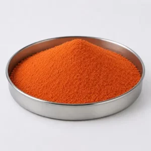 Orange polymer additive powder in a stainless steel sample dish