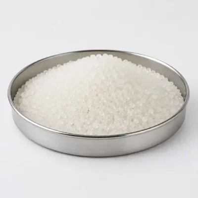 Virgin polymer pellets and molding granules in a stainless steel sample dish