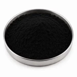 Fine carbon black powder in a shallow stainless steel sample dish