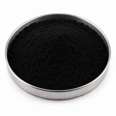 Fine carbon black powder in a stainless steel sample dish