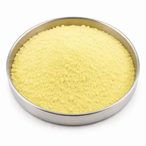 Yellow rubber curative powder in a shallow stainless steel sample dish