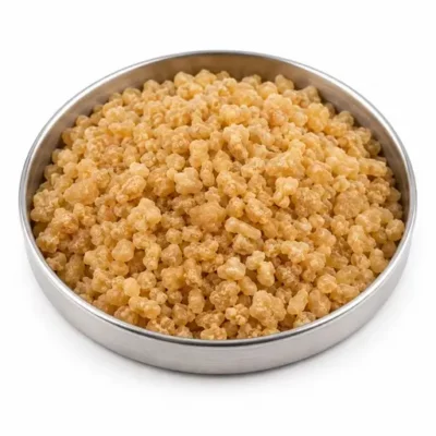 Natural rubber granules in a stainless steel sample dish