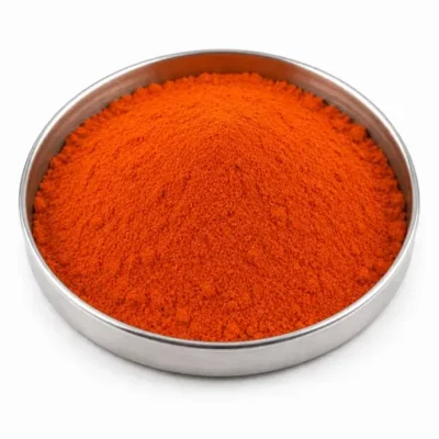 Colored rubber additive powder in a stainless steel sample dish