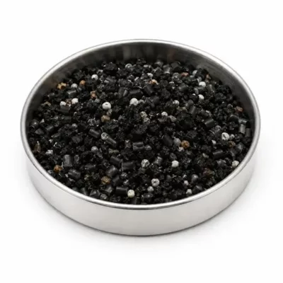 Mixed rubber compound feedstock in a stainless steel sample dish