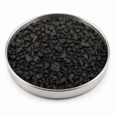 Irregular recycled rubber crumb in a stainless steel sample dish