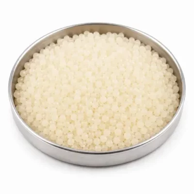 Synthetic rubber pellets in a stainless steel sample dish